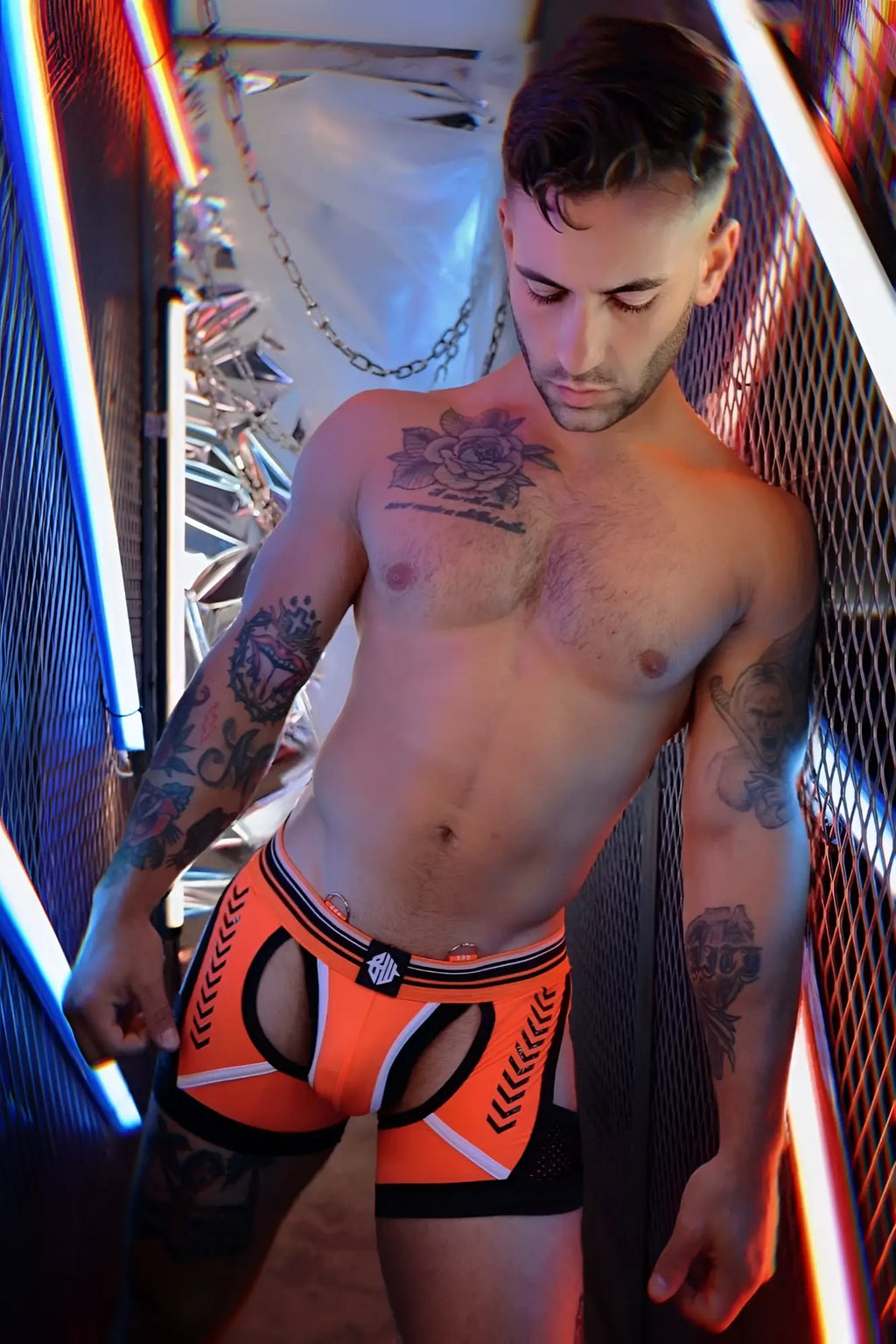 Circuit breaker chock orange and black athletic briefs with white chevron detailing and branded waistband logo