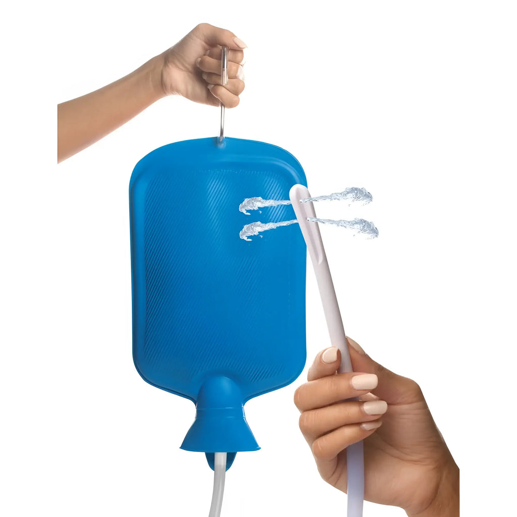 Blue silicone hot water bottle with white spout and tubing in cleanstream deluxe shower enema bag and nozzle kit