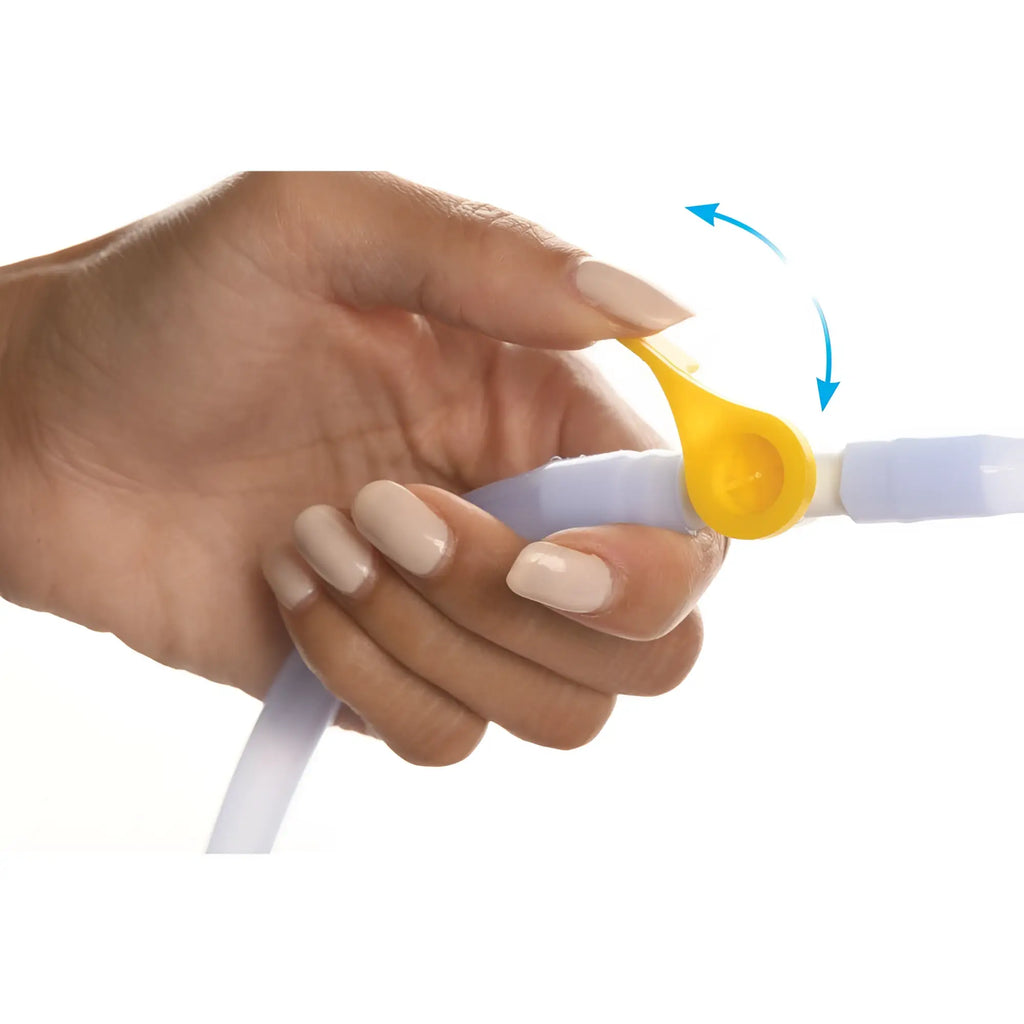 Yellow plastic clamp with circular handle on translucent tubing of cleanstream deluxe shower enema bag and nozzle kit