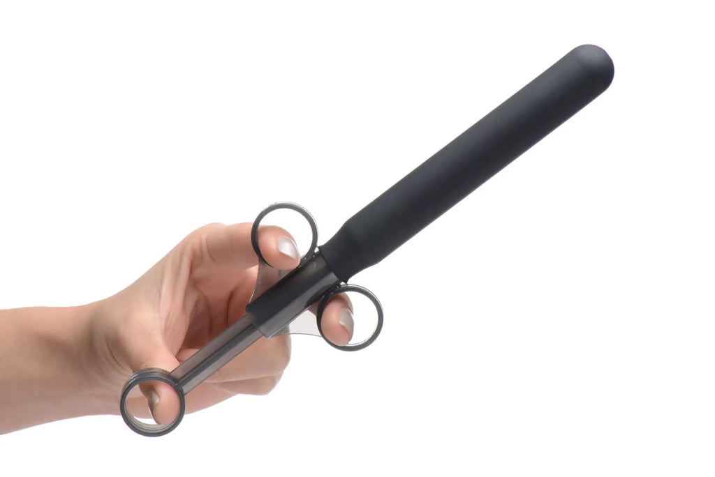 Black ergonomic grip curling iron with three metal rings along handle for cleanstream smooth silicone lubricant launcher