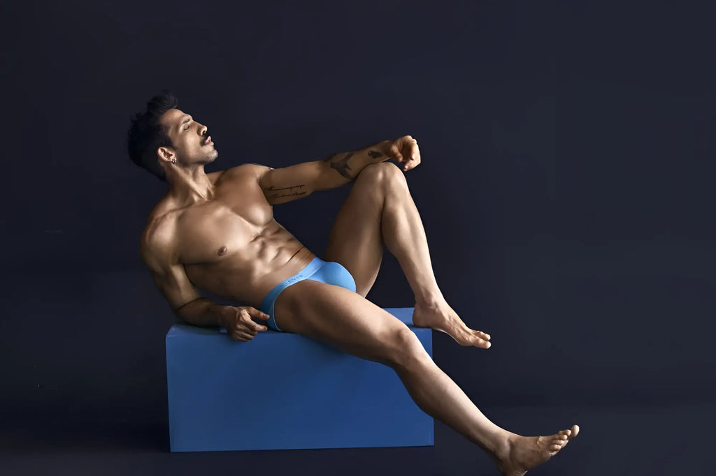 A man wearing bright blue clever 1749 eco bikini briefs made from sustainable material shown from the front