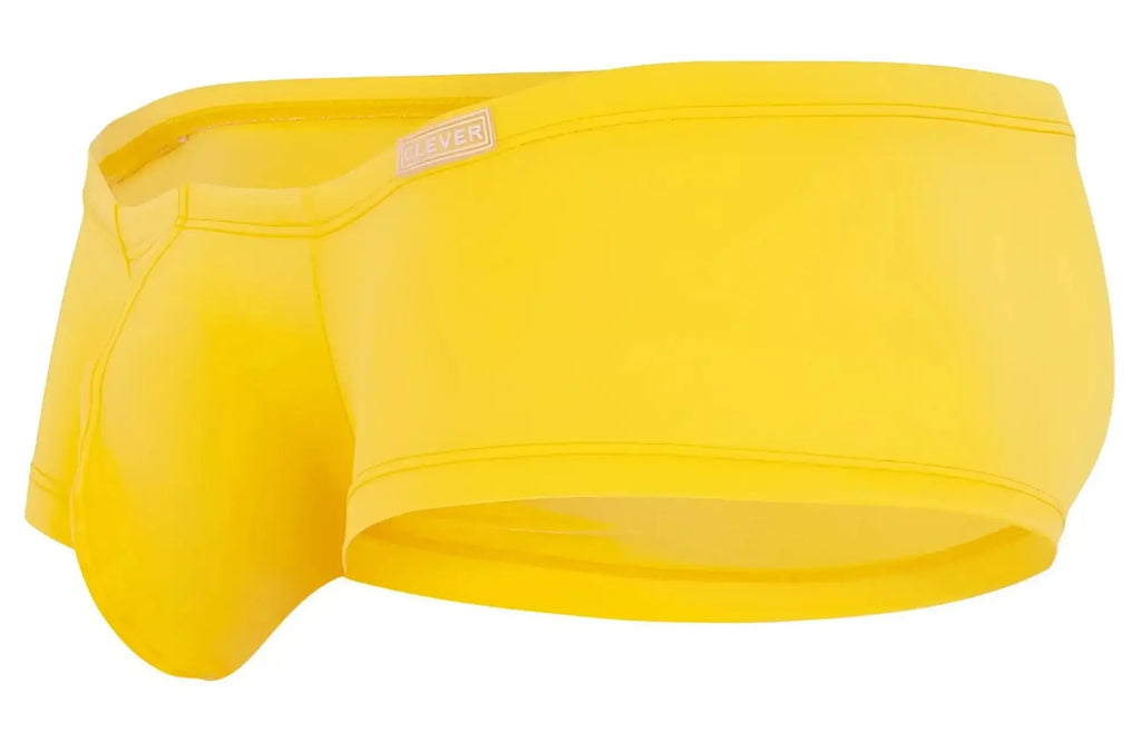 Bright yellow men’s sleek form-fitting swim trunks with sayer tag from clever.