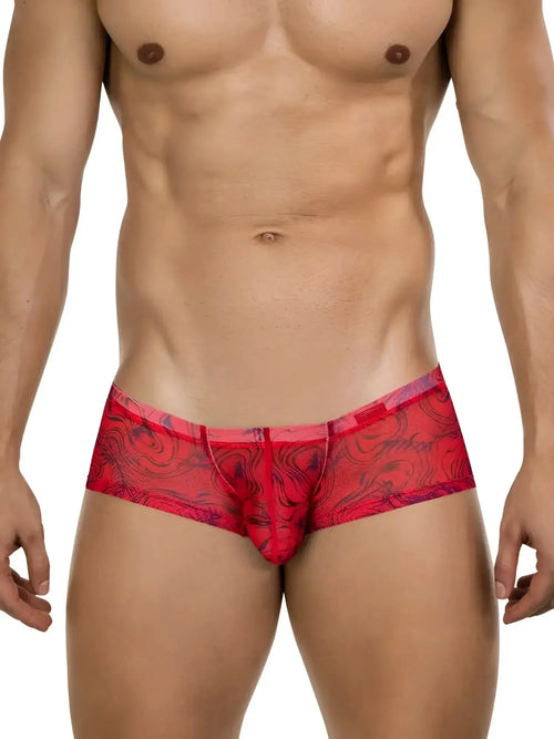 Front view of Clever 26032 Calipso trunks in red with a patterned, semi-sheer mesh design on a male model.