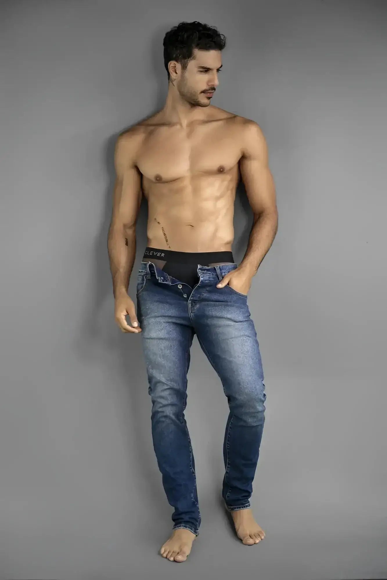 Clever 26059 Tanatos black briefs, lifestyle shot of a man wearing underwear and unbuttoned jeans.