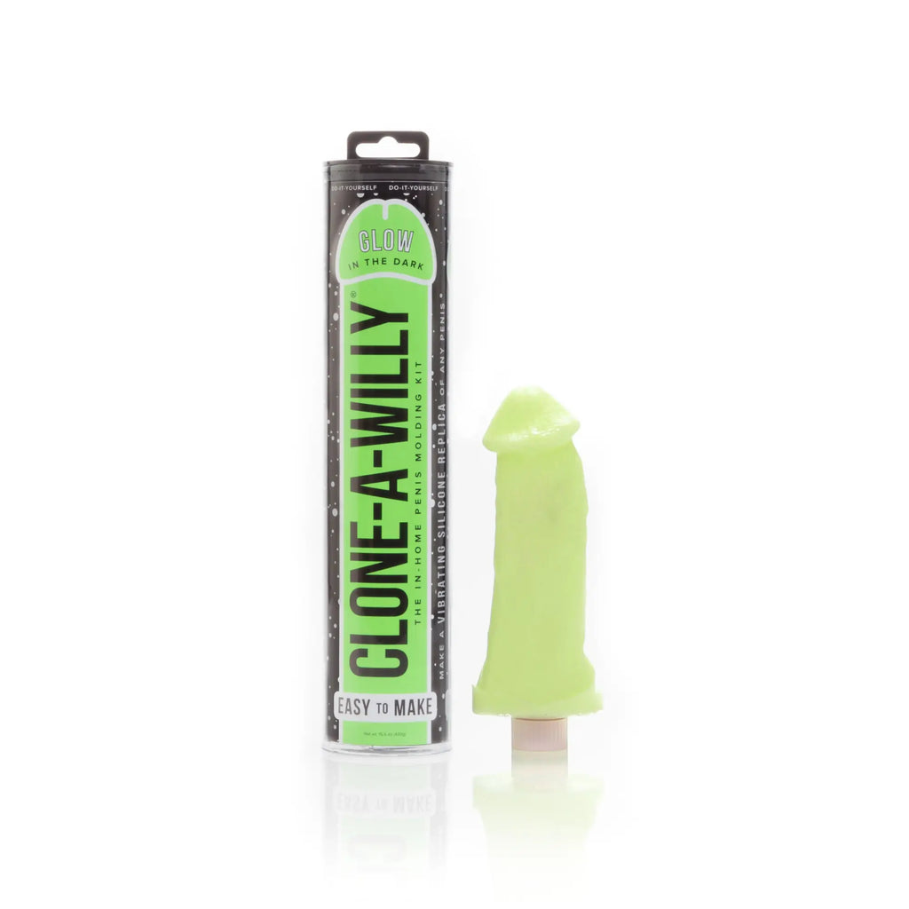 Lime green silicone vibrating penis replica from the clone a willy kit shown in glowing green color