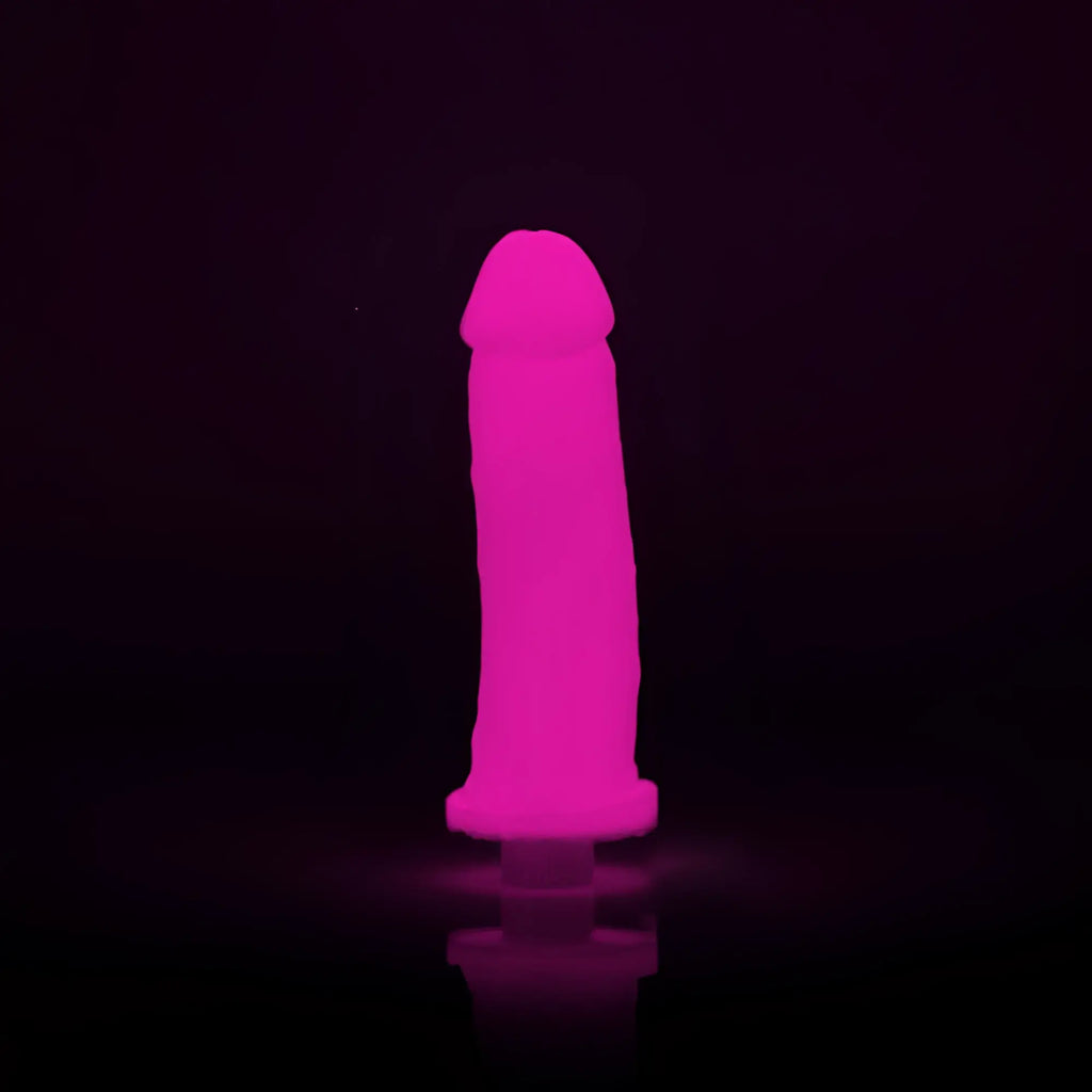 A glowing pink silicone toy with a rounded head and tapered base from clone a willy glow pink product line