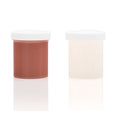 Two translucent plastic jars with silicone refill medium skin tone terracotta and cream substances in clone a willy kit