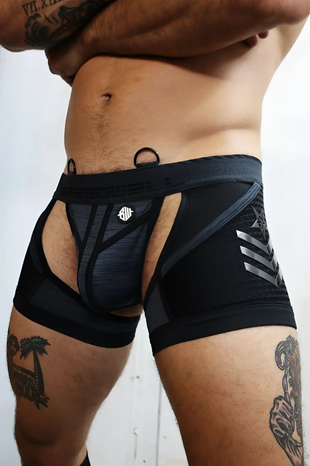 Black athletic briefs cockpit chock with gray geometric accents and silver logo on front for active use
