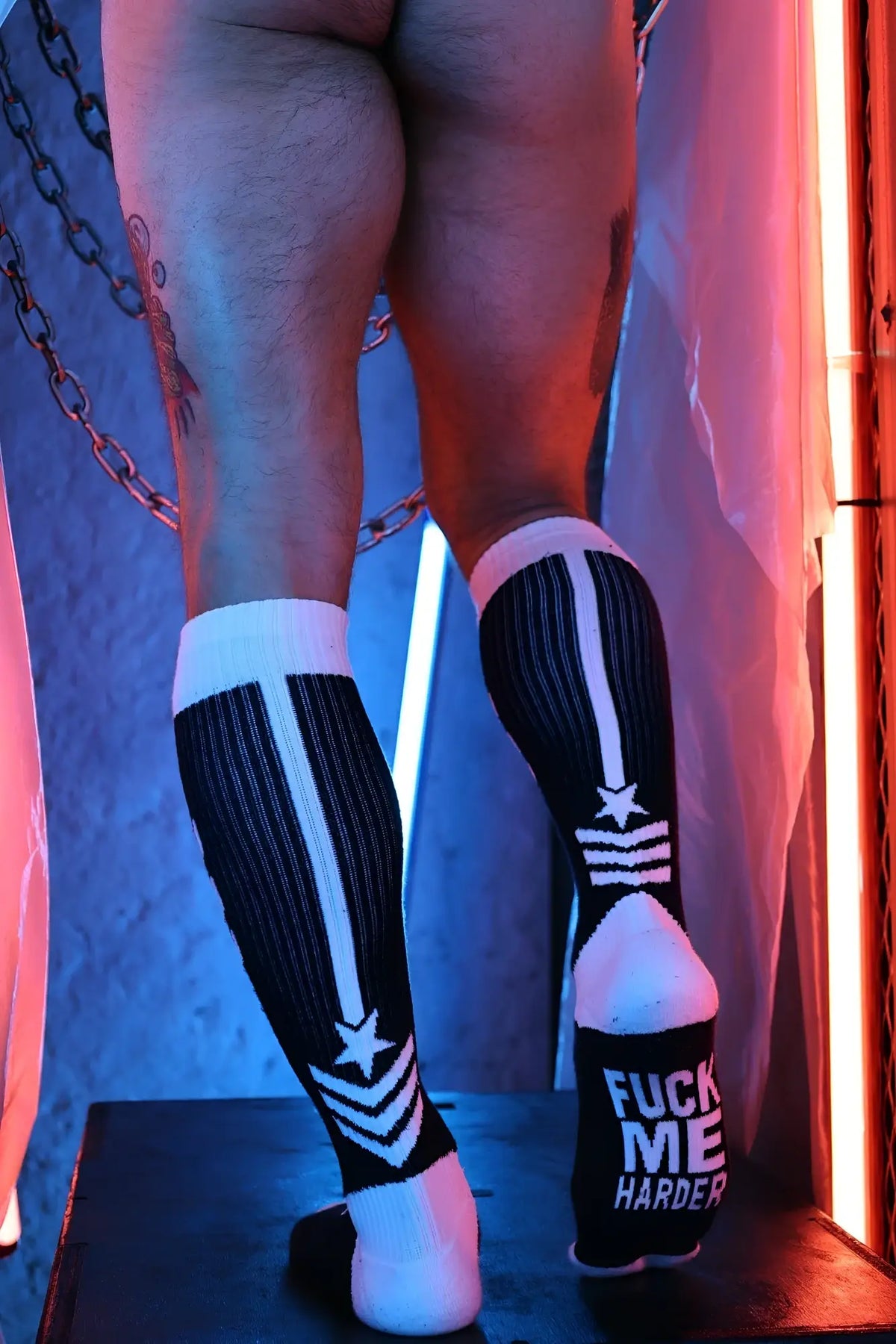 Cockpit socks black and white striped knee-high socks with star and stripes design and bold text on the heel back side