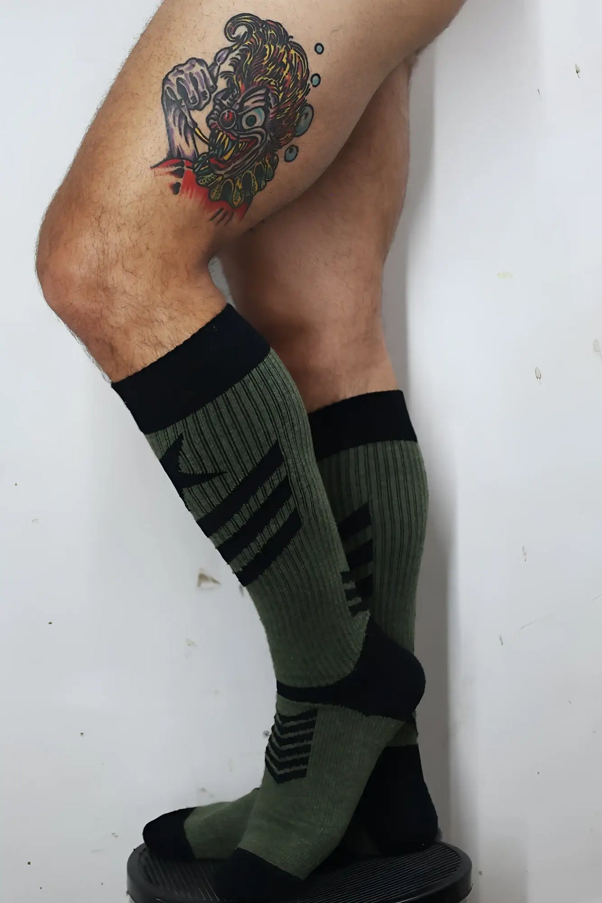 Cockpit socks olive green and black athletic compression socks with ribbed texture and bold horizontal stripes