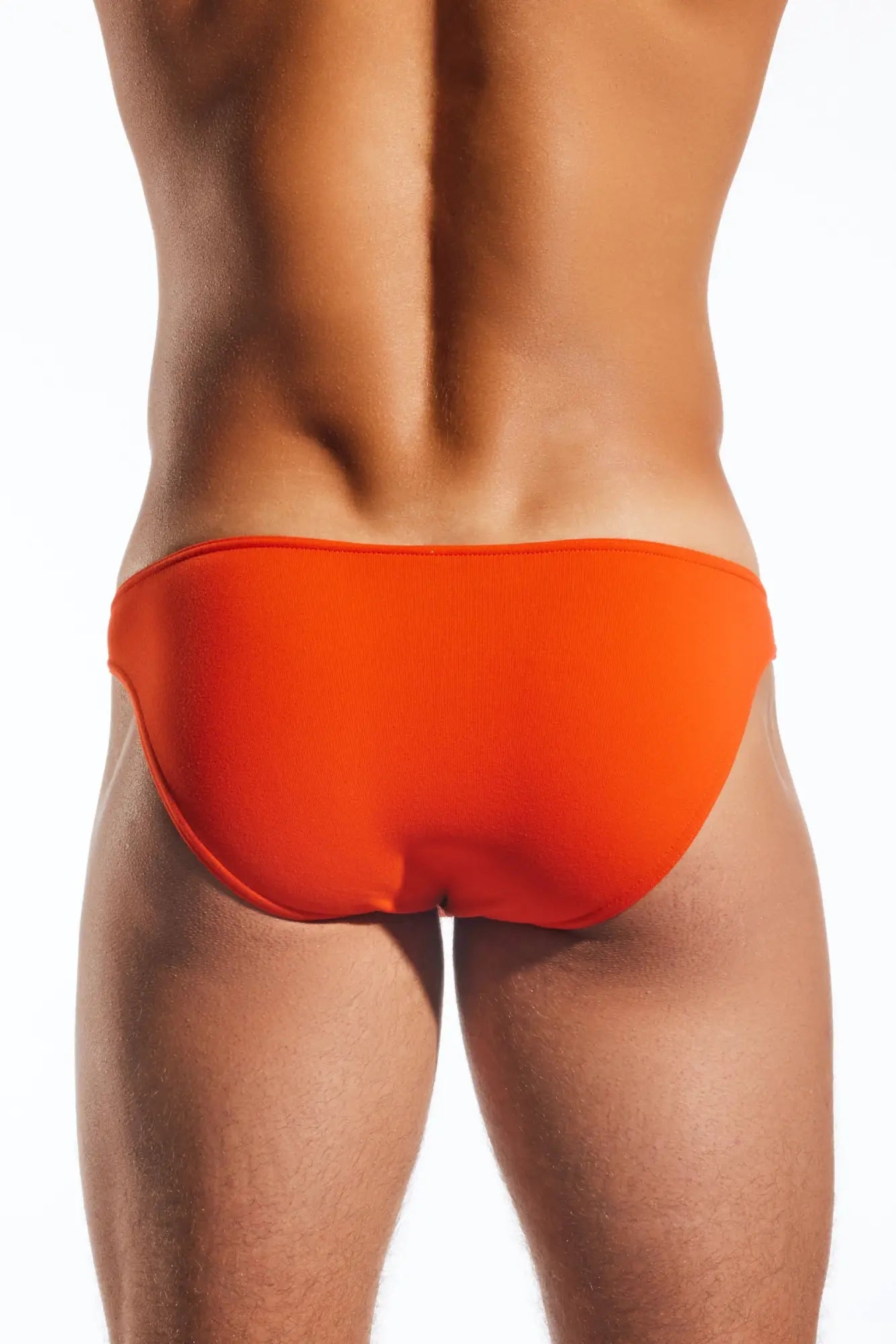 Bright orange Cocksox CX01 Brief swim trunks with a smooth form-fitting design ideal for swimming and water activities