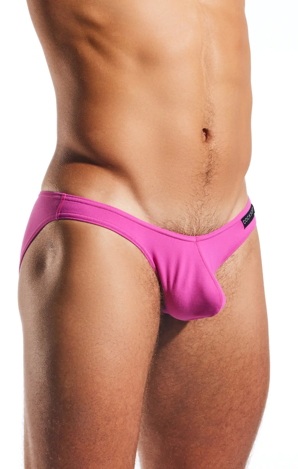 Bright pink cocksox cx01 brief swim trunks with a distinctive cut and smooth fabric in a form-fitting design