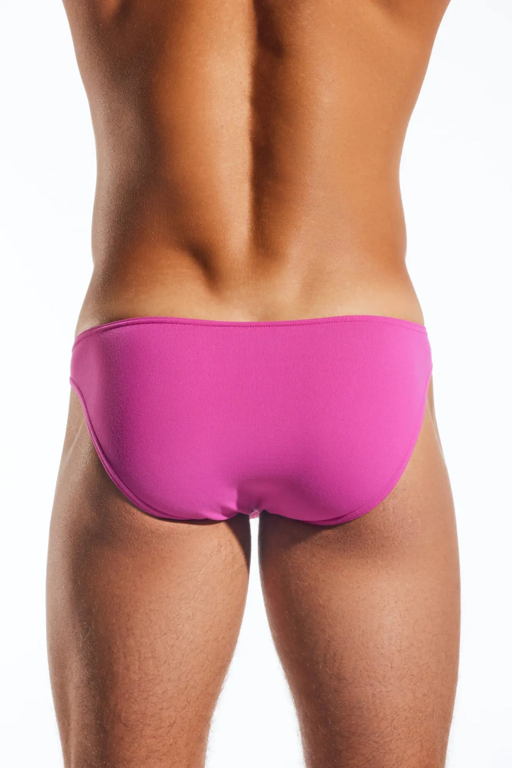 Bright pink cocksox cx01 brief swim trunks with smooth form fitting design for comfortable beachwear