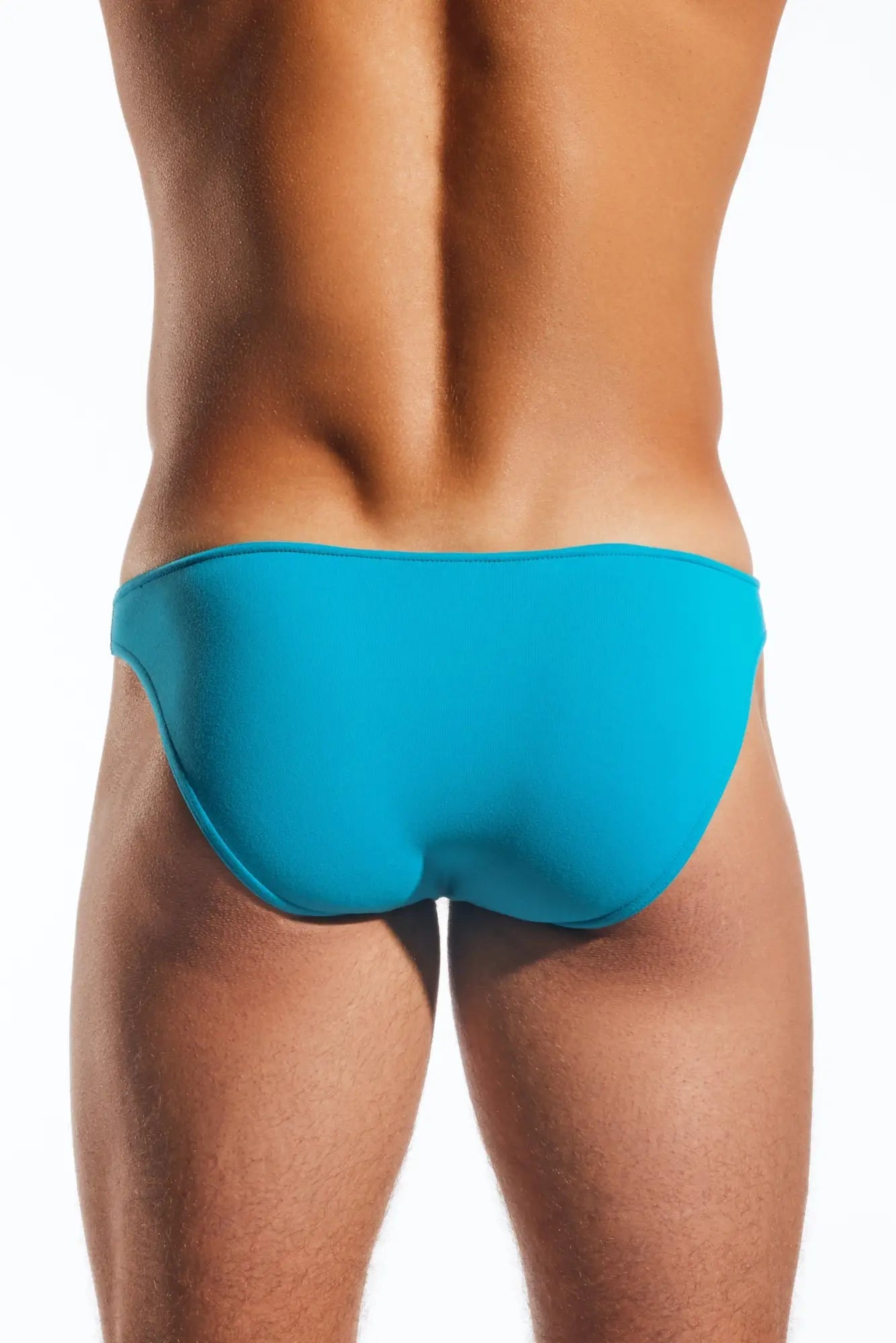 Bright turquoise cocksox cx01 brief swim trunks with smooth form-fitting design suitable for swimming and beachwear