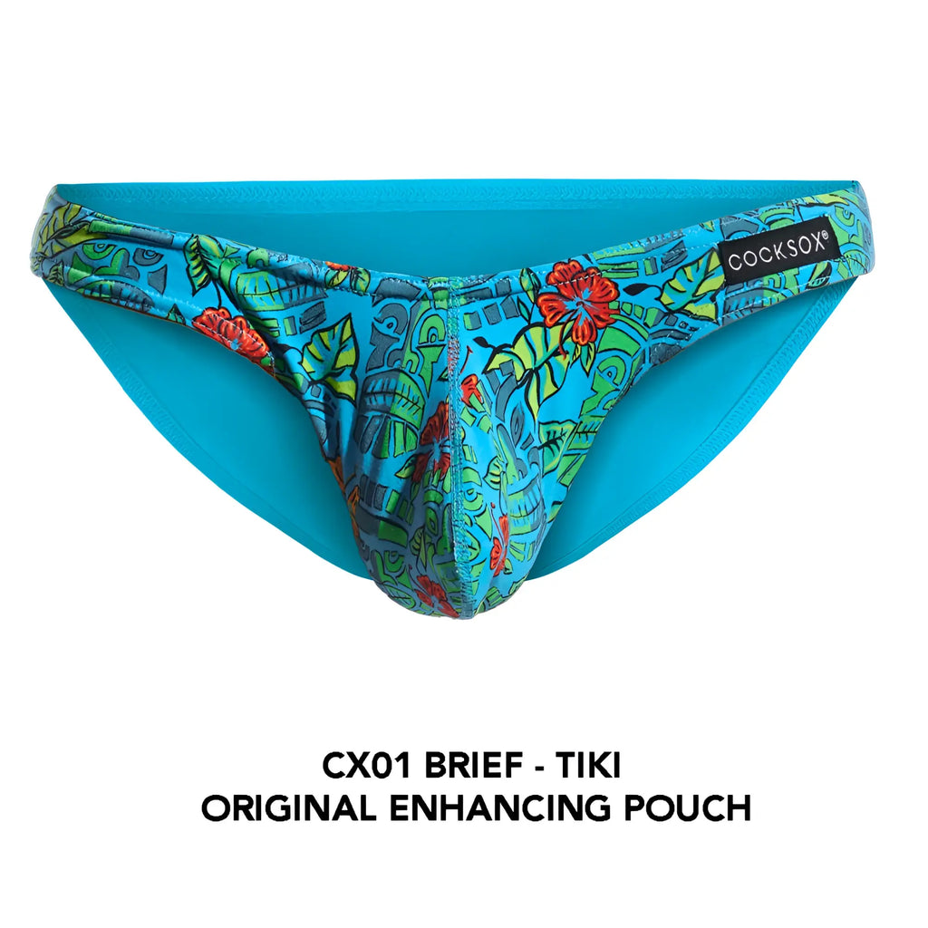 Cocksox cx01 brief in bright turquoise with a tropical tiki pattern featuring green leaves red flowers and stylized faces