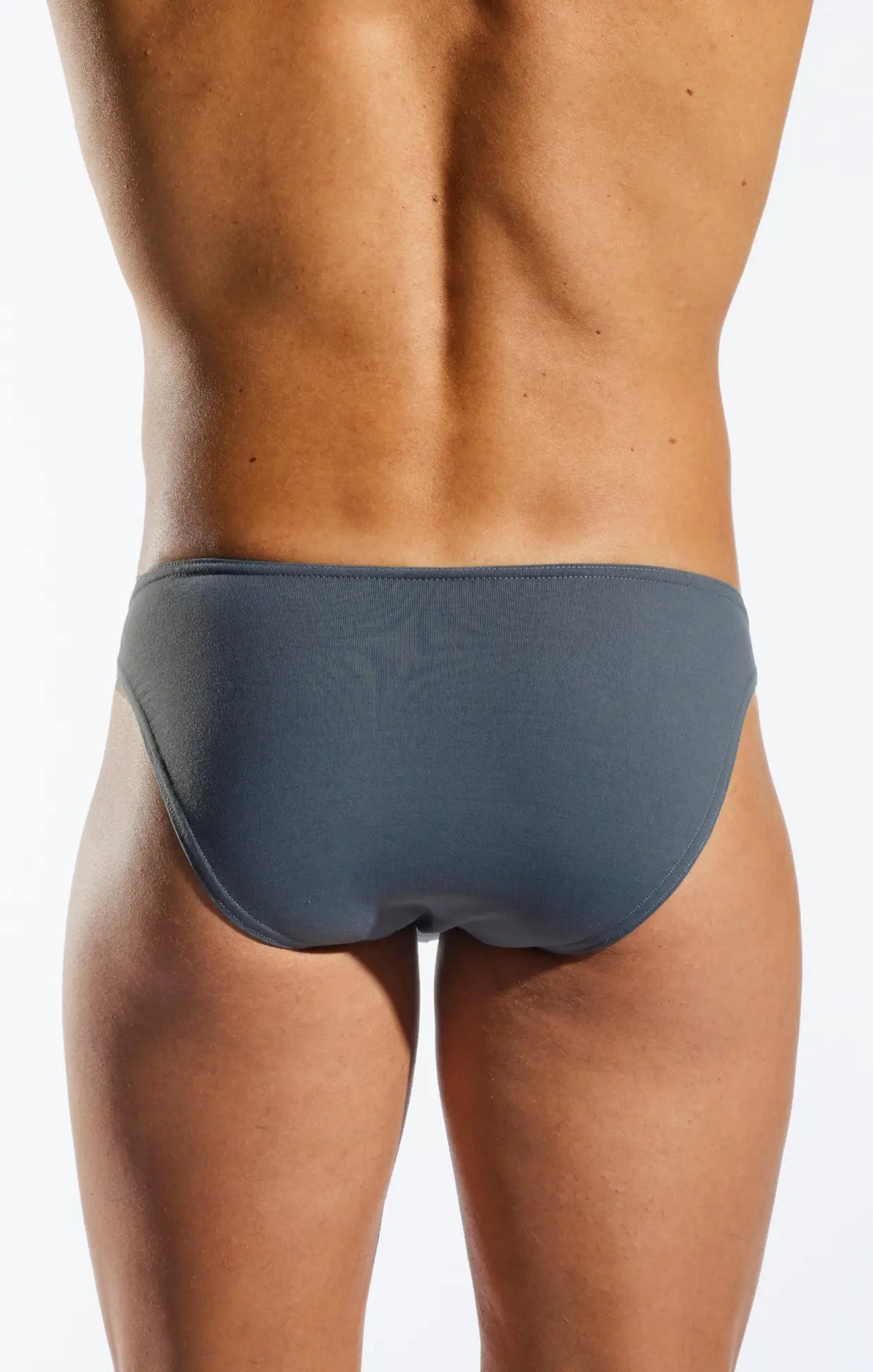 Back view of gray cocksox cx01 brief with smooth form-fitting fabric and subtle logo on the back