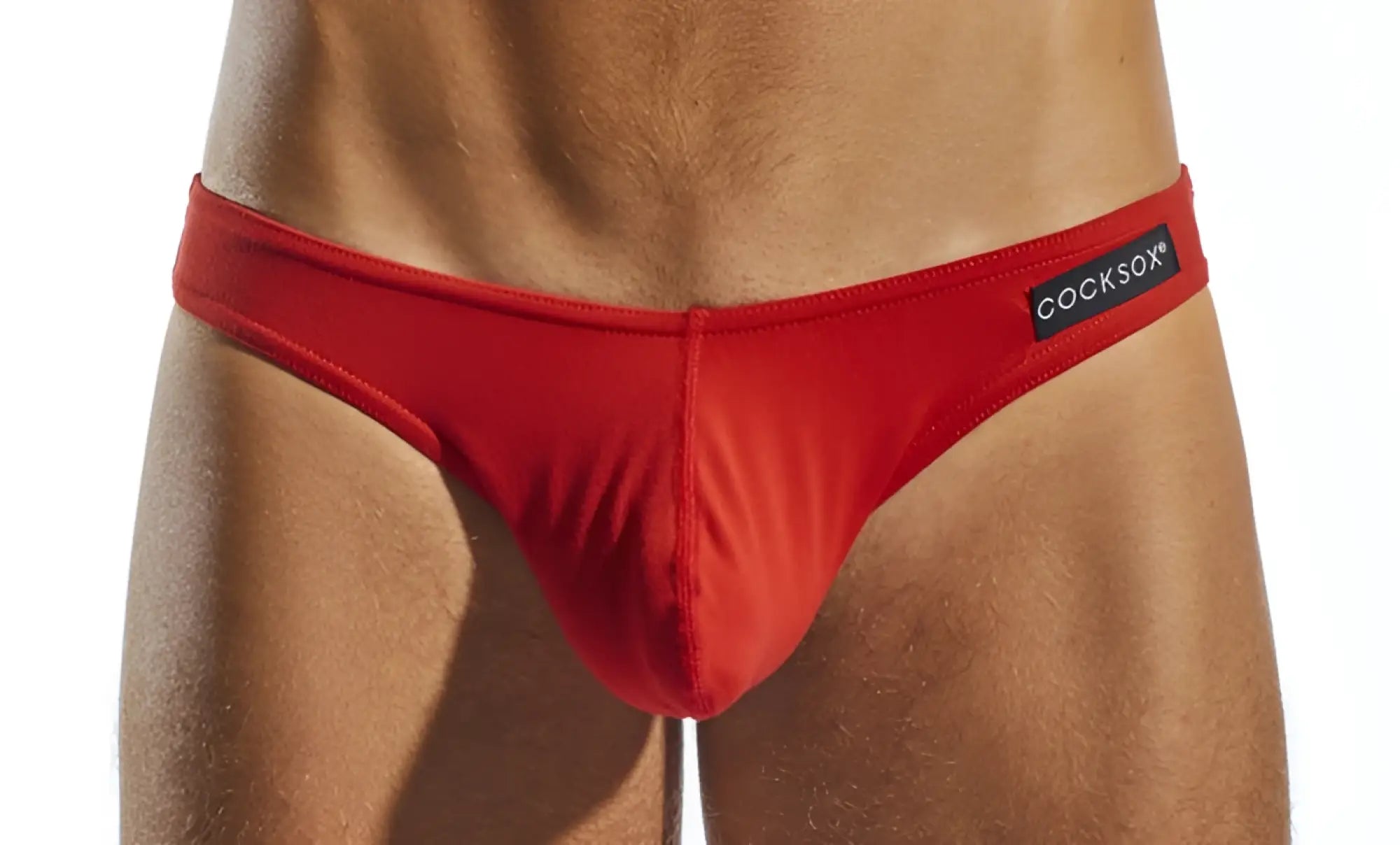 Red cocksox men’s briefs with black brand label featuring breathable fabric for comfortable everyday wear