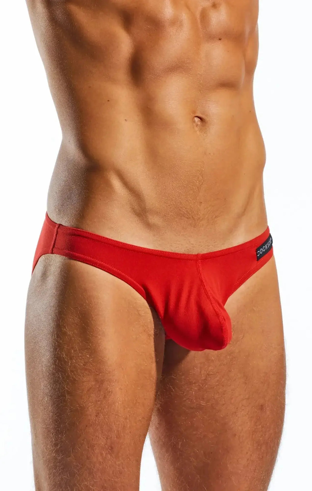 Red cocksox cx01 brief with sleek form-fitting design and black brand tag on waistband