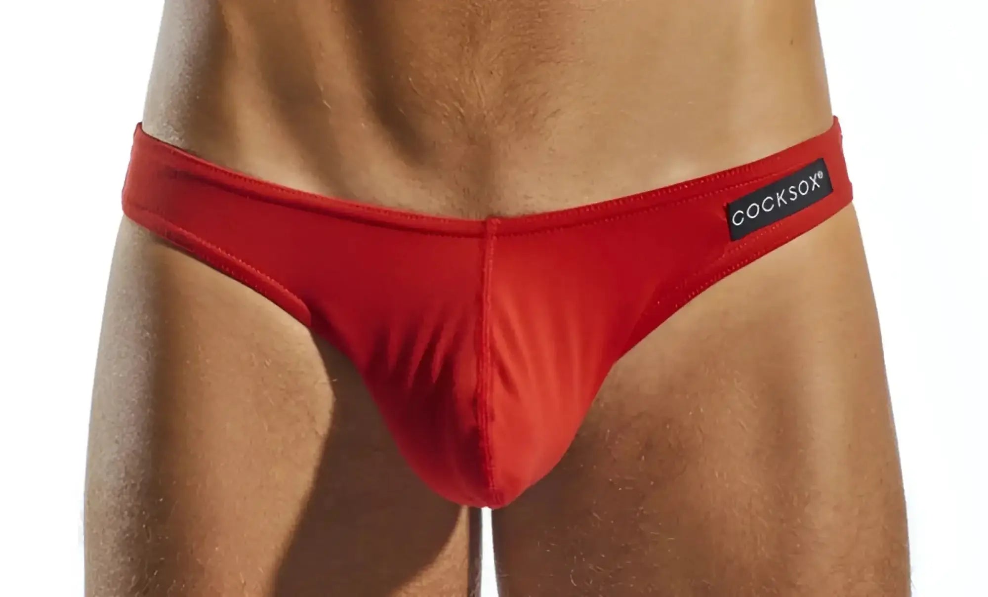 Red cocksox men’s briefs with black brand label featuring breathable fabric for comfortable everyday wear