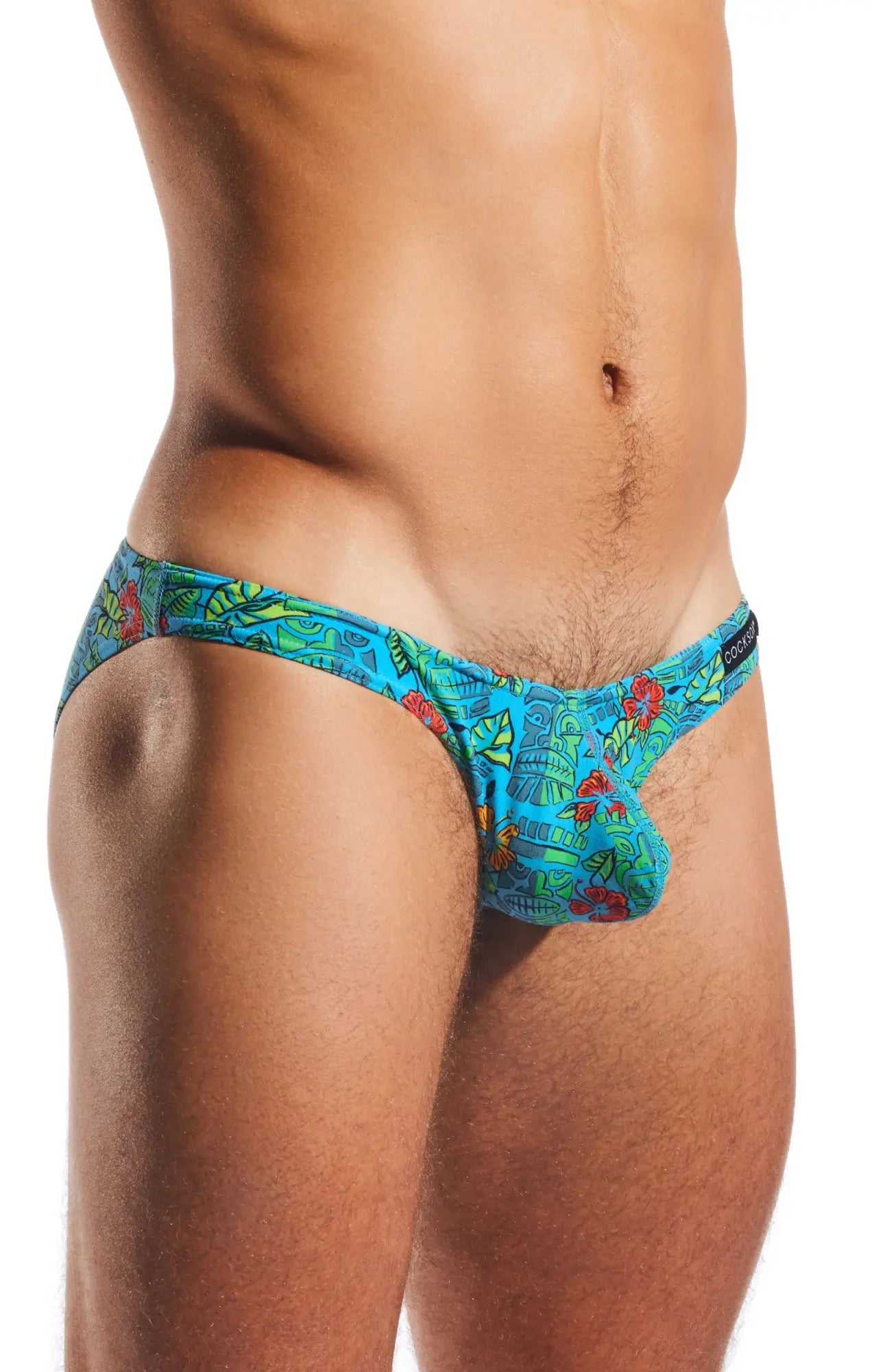 Cocksox cx01 brief vibrant turquoise swim trunks with red and green tropical floral print for beachwear