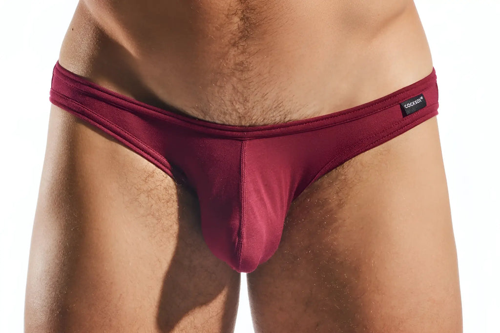 Maroon cocksox cx01md brief with sleek smooth fabric, form-fitting design, and black brand tag on waistband