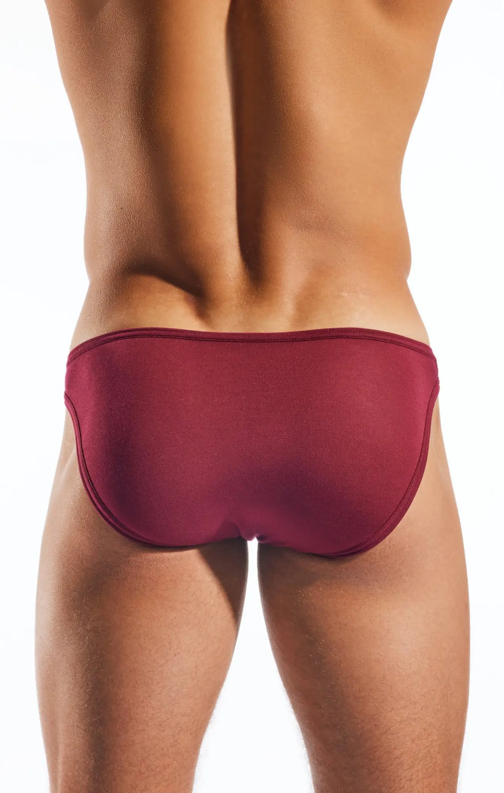 A sleek deep red Cocksox CX01MD brief swim trunk with smooth form-fitting fabric and clean seams