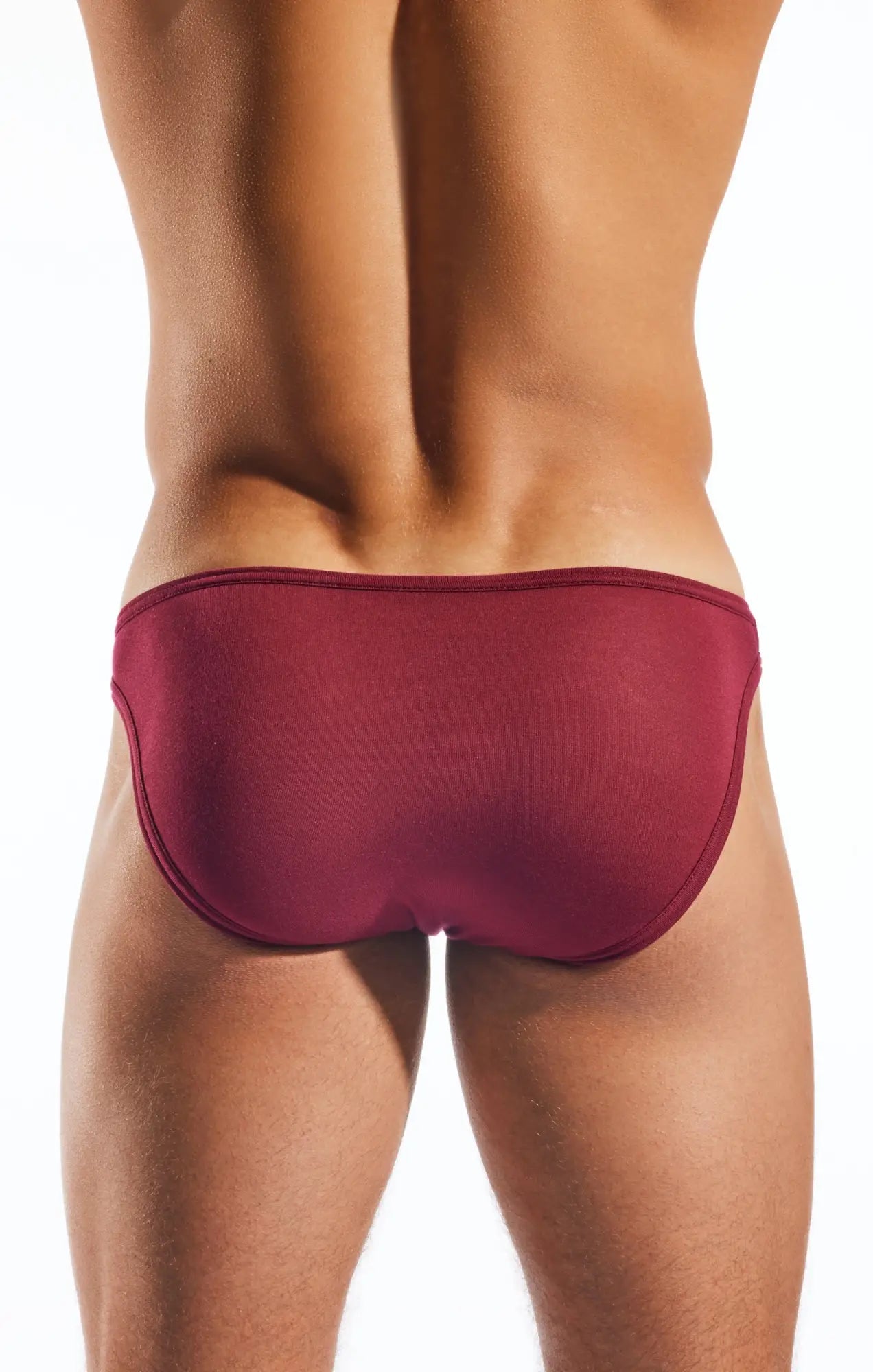 A sleek deep red Cocksox CX01MD brief swim trunk with smooth form-fitting fabric and clean seams