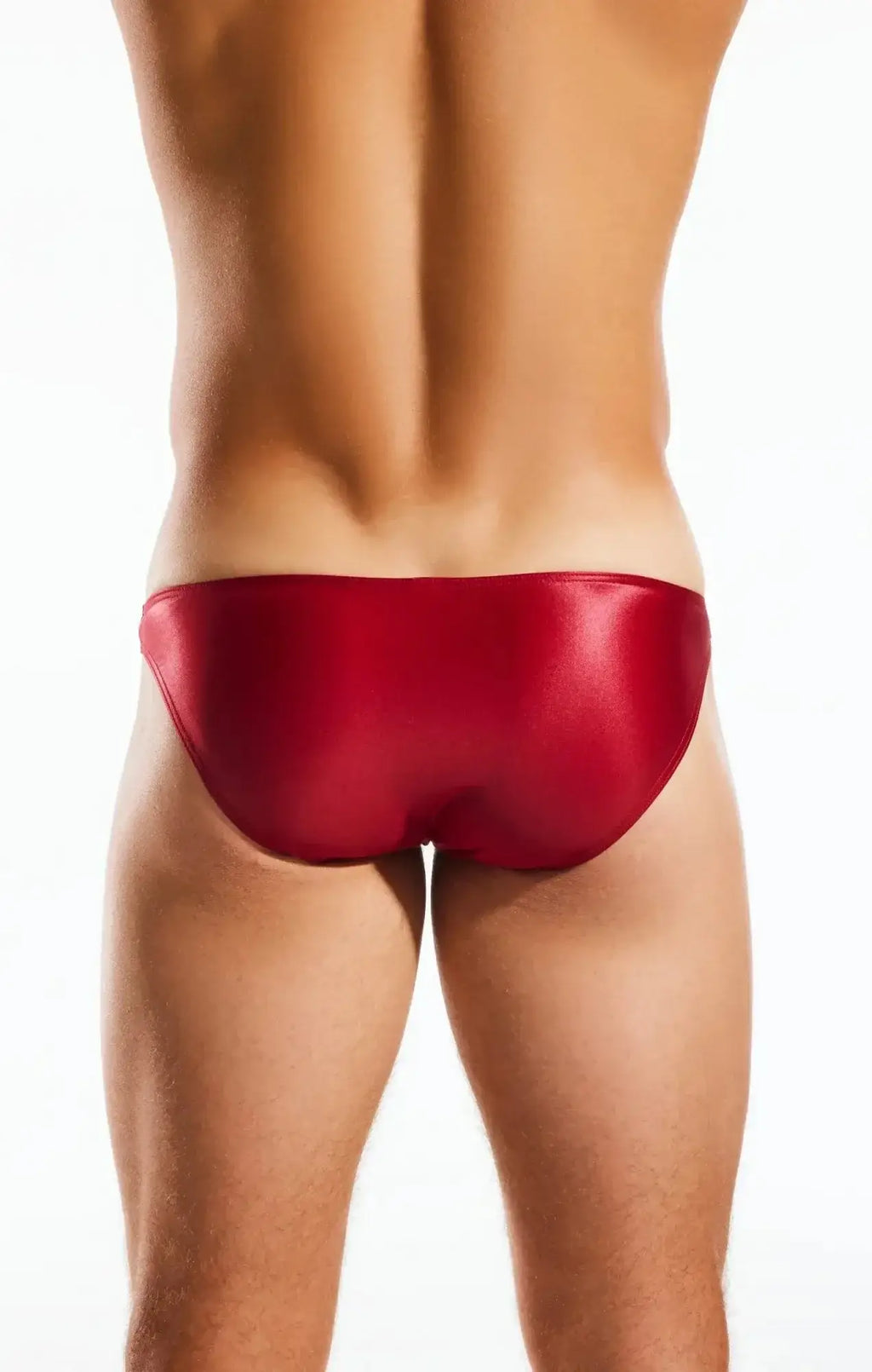 A sleek glossy red cocksox cx02gs swim brief with smooth form-fitting design for swimming and beachwear