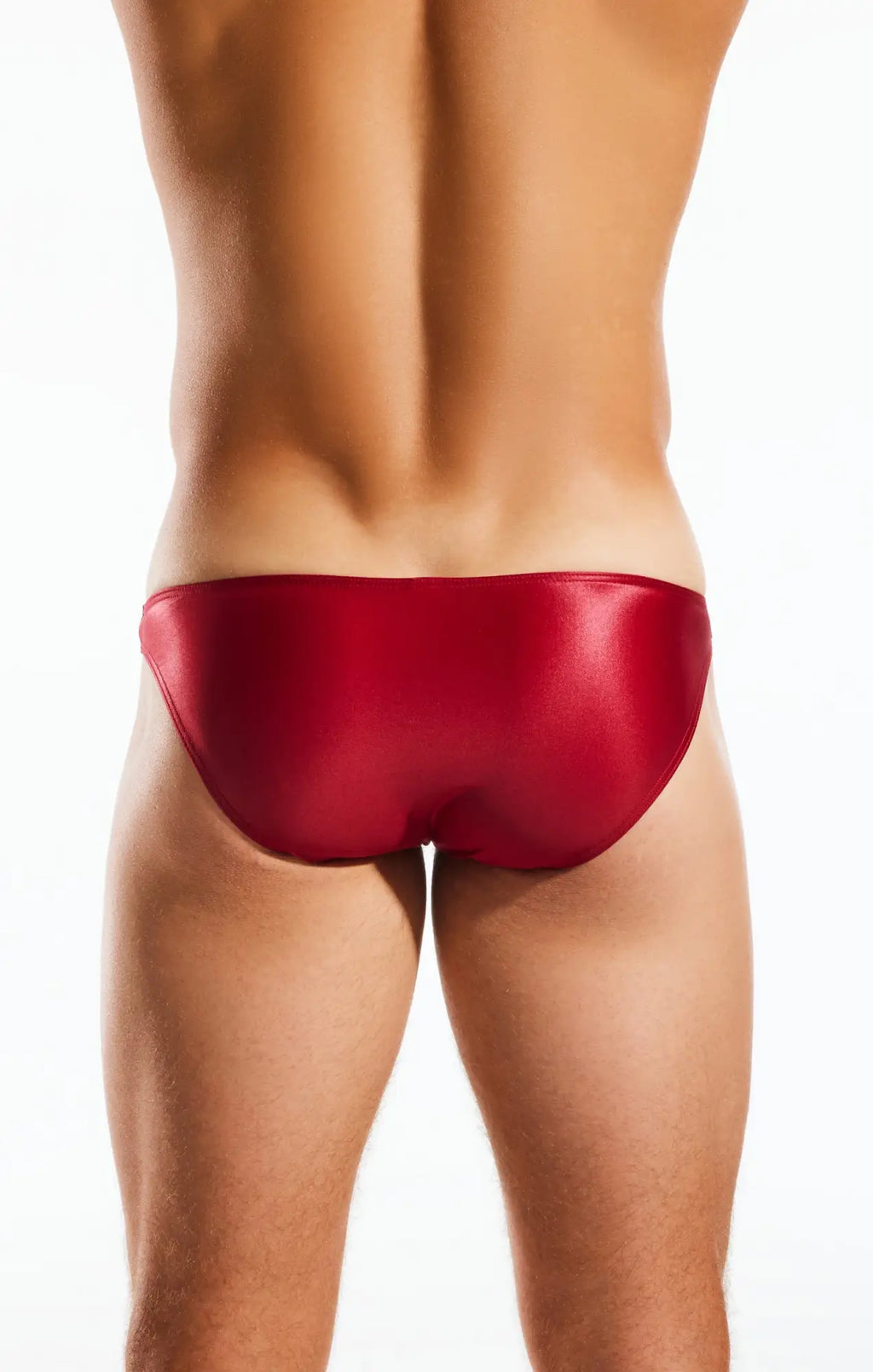 A sleek glossy red cocksox cx02gs swim brief with smooth form-fitting design for swimming and beachwear
