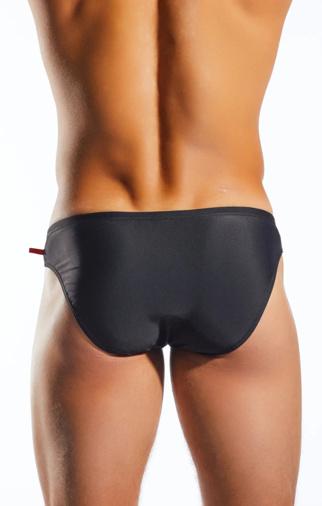 Black cocksox CX04 drawstring swim brief with subtle sheen and small red tab on the side for comfortable wear