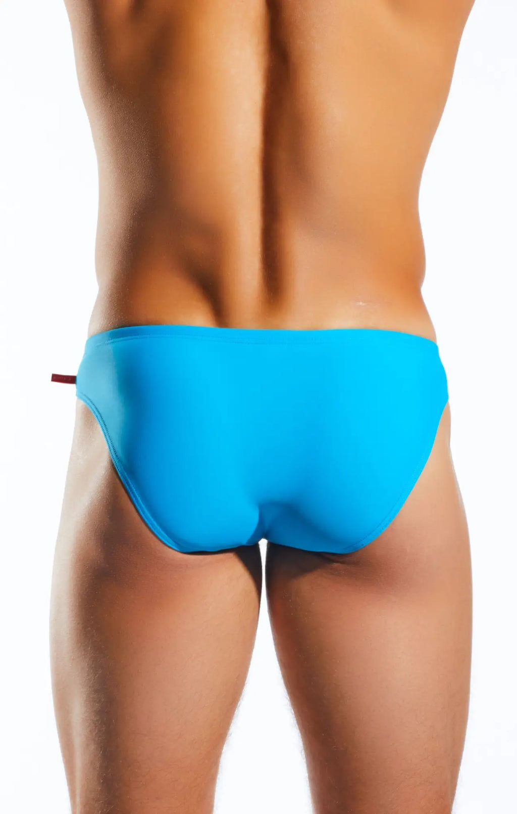 Bright blue Cocksox CX04 drawstring swim brief with sleek form-fitting design and small red tab on the side