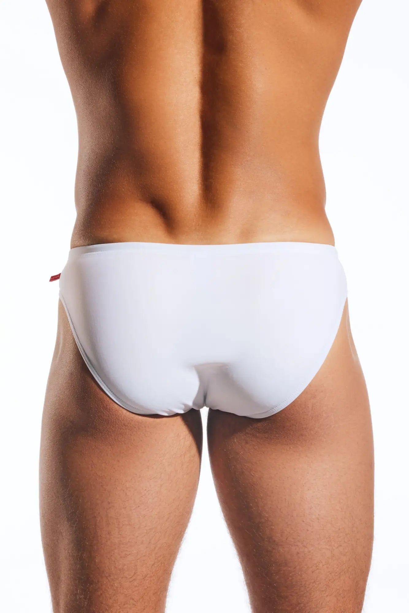 White cocksox cx04 drawstring swim brief with a subtle red tab on the side in brief style