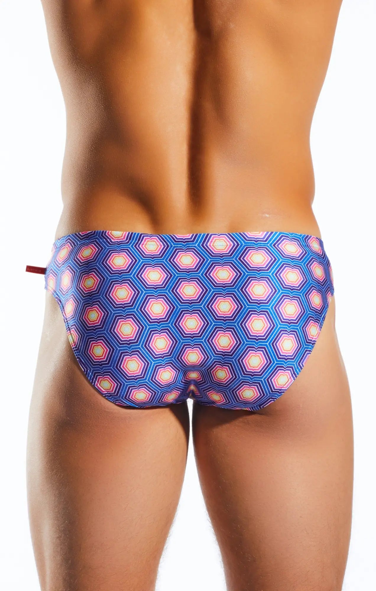Cocksox CX04PR drawstring swim brief featuring blue and pink geometric hexagonal patterned swim trunks