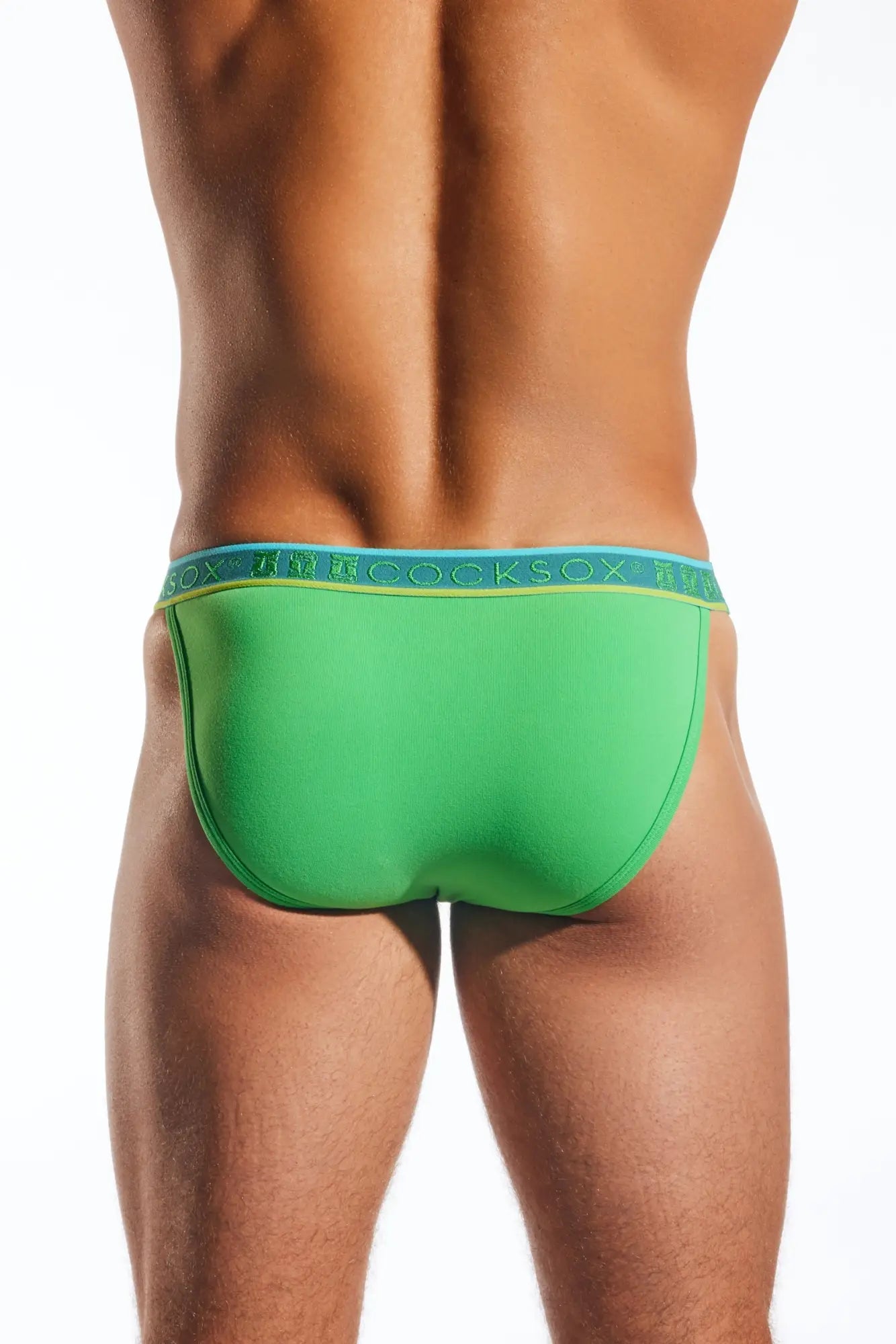 Bright green cocksox cx16n bikini brief with blue waistband and yellow brand lettering for comfortable daily wear