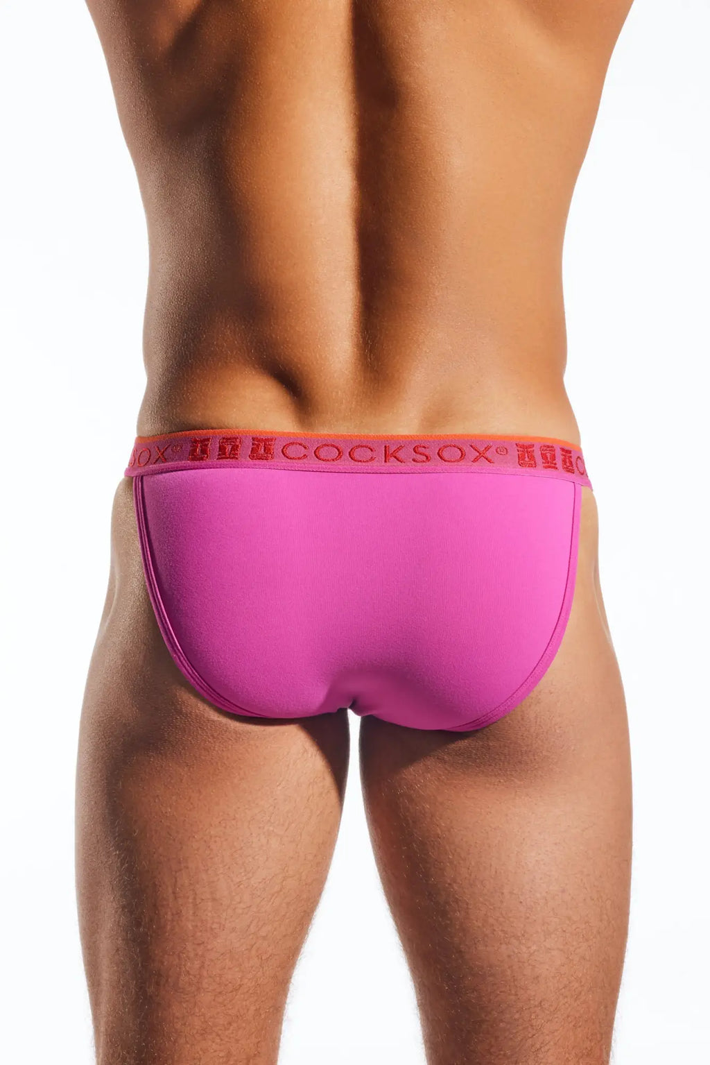 Bright pink cocksox cx16n bikini brief with red waistband featuring brand logo in men’s underwear collection