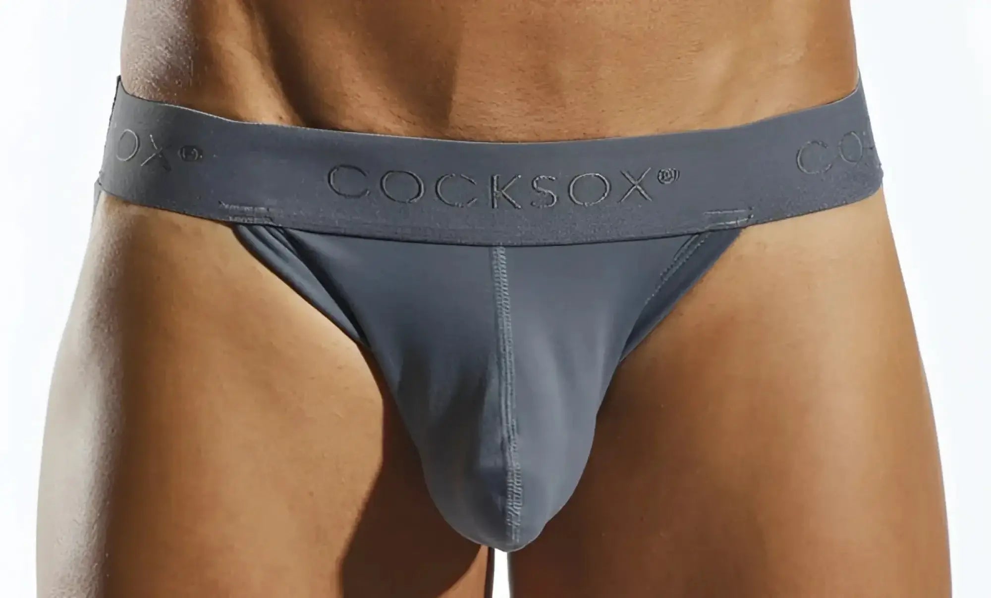 Gray cocksox cx21n jockstrap with smooth form-fitting design and subtle embossed branding on the waistband