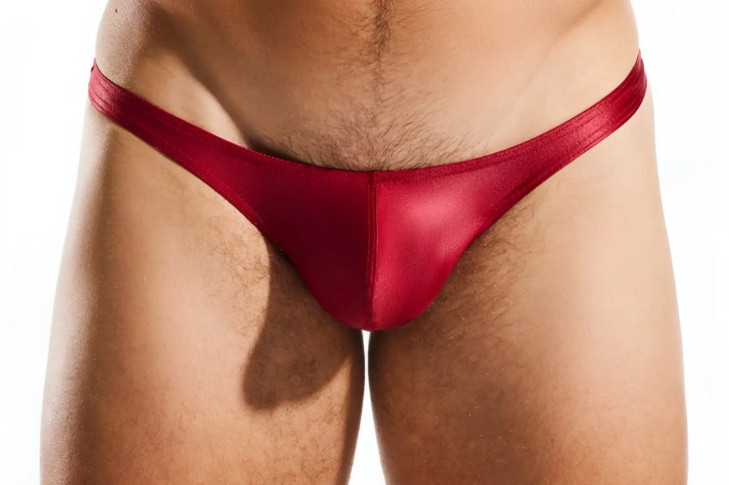 Red satin cocksox cx22gs swim thong with smooth shiny finish designed for swimwear use