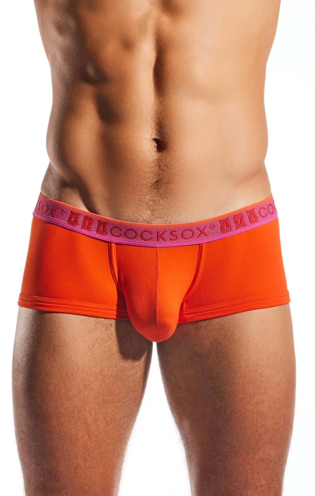 Bright orange cocksox cx68n trunk briefs with pink elastic waistband featuring repeating brand name lettering