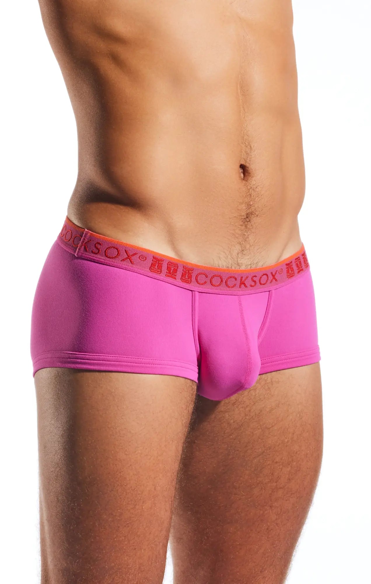 Bright pink cocksox cx68n trunk briefs with orange waistband and red brand name lettering for men