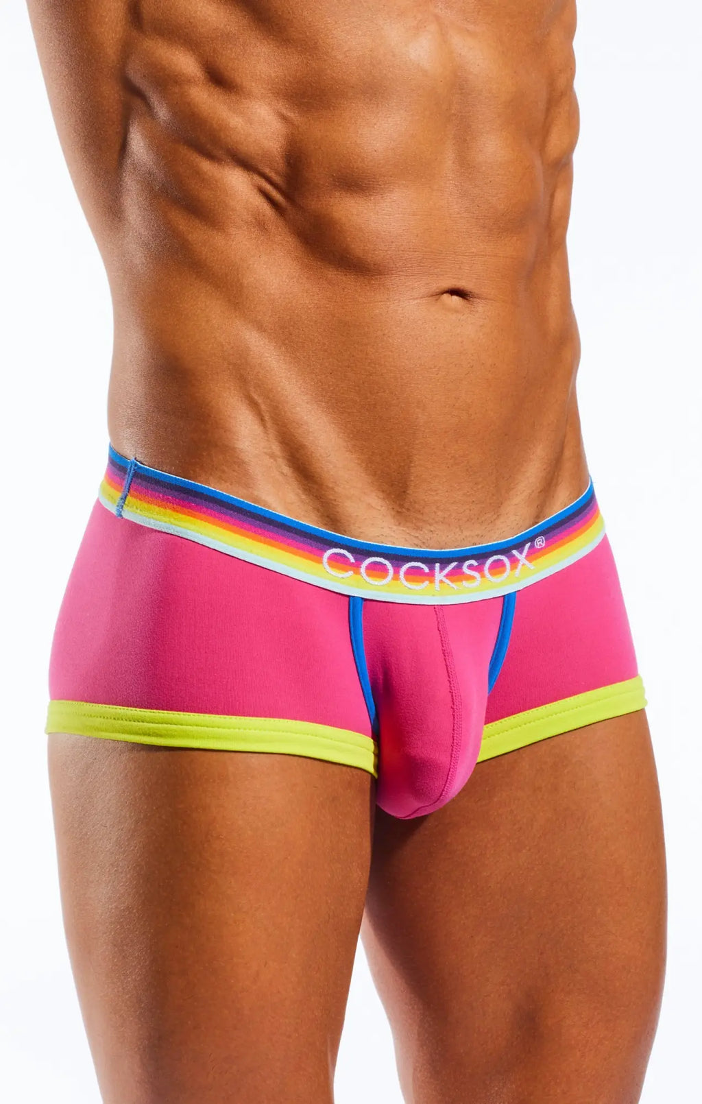 Bright pink cocksox cx68n trunk briefs with rainbow-striped waistband and neon green trim for men