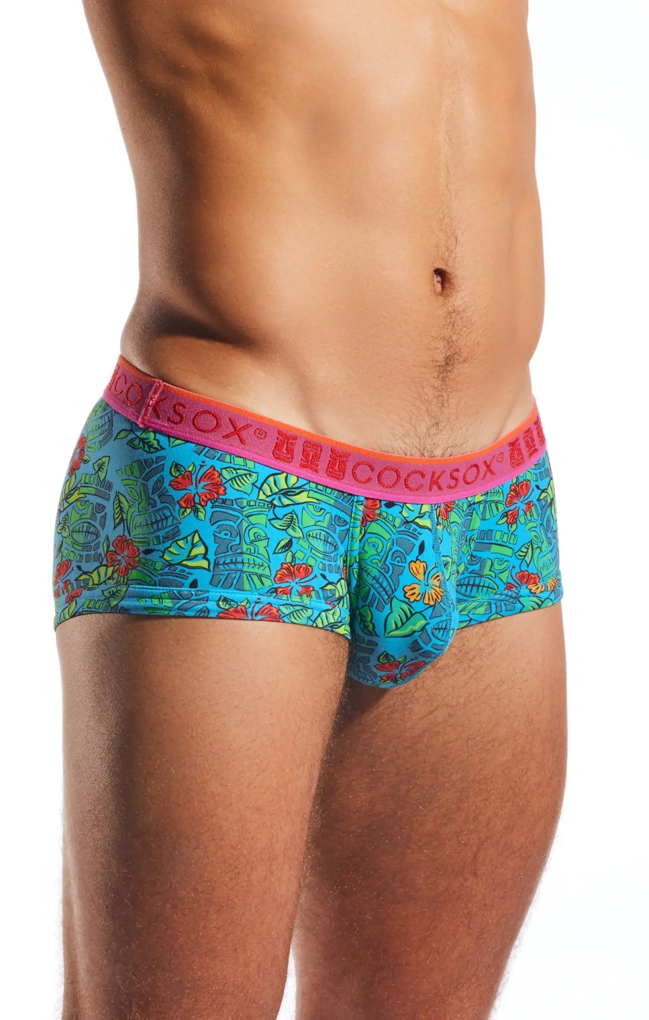 Bright turquoise tropical-patterned men’s briefs with pink waistband featuring the cocksox brand name cocksox cx68n trunk