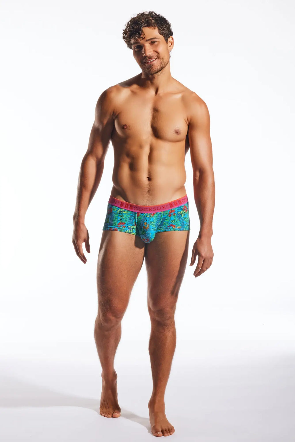 Turquoise patterned Cocksox CX68N trunk briefs with a pink waistband designed for comfortable daily wear
