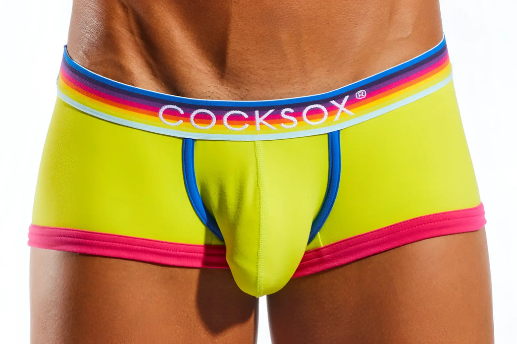 Vibrant lime green cocksox cx68n trunk briefs with rainbow-striped waistband and bold pink trim for men