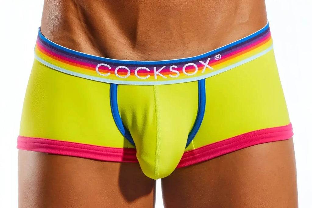 Vibrant lime green cocksox cx68n trunk briefs with rainbow-striped waistband and bold pink trim for men