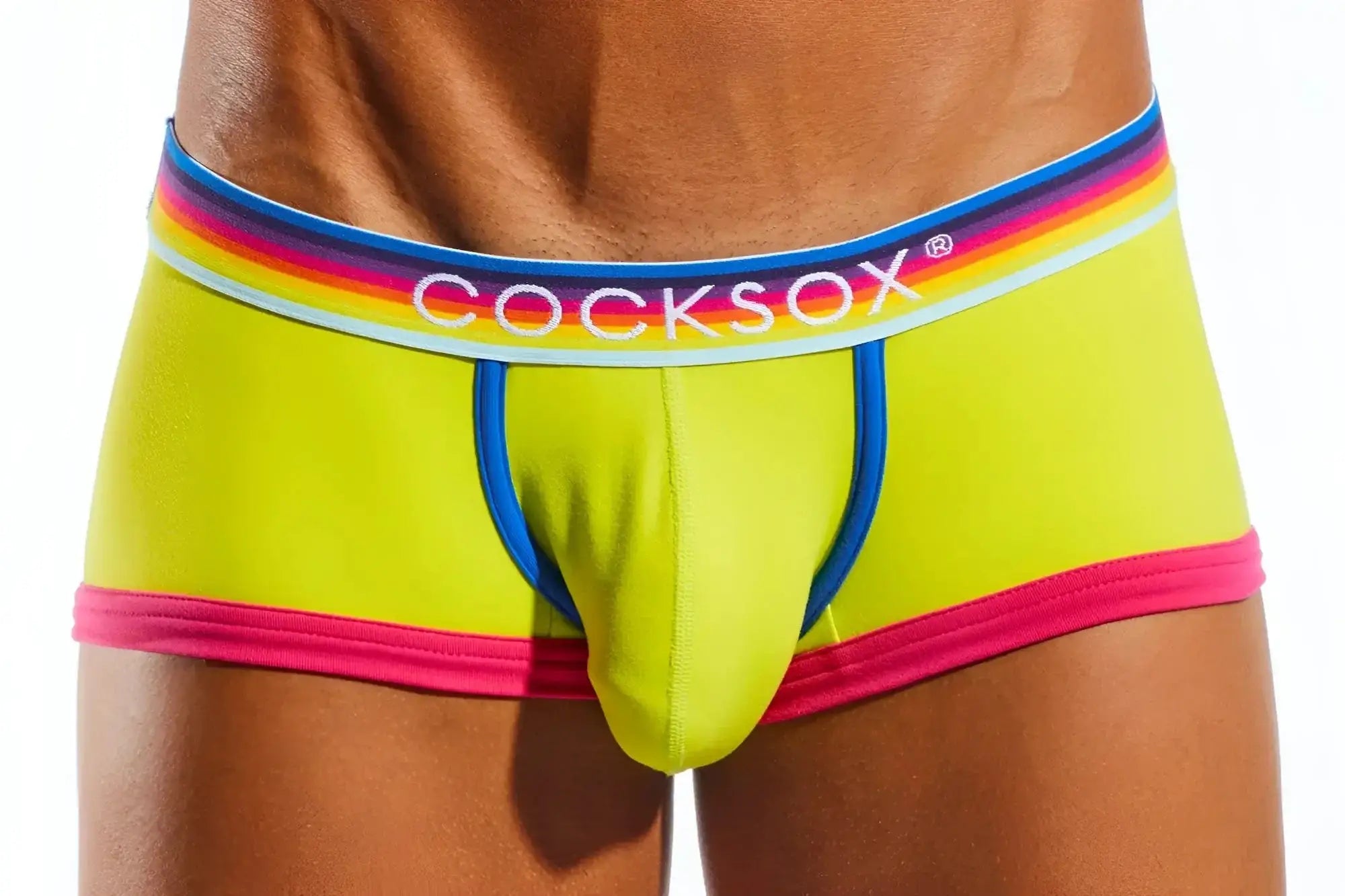 Vibrant lime green cocksox cx68n trunk briefs with rainbow-striped waistband and bold pink trim for men