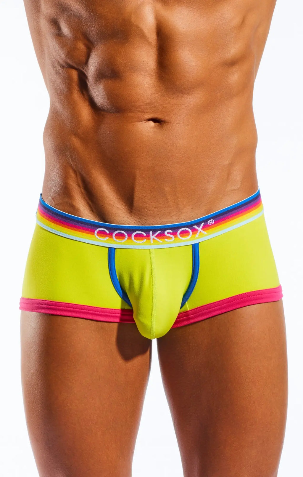 Vibrant neon yellow cocksox cx68n trunk briefs with rainbow-striped elastic waistband and pink blue white trim