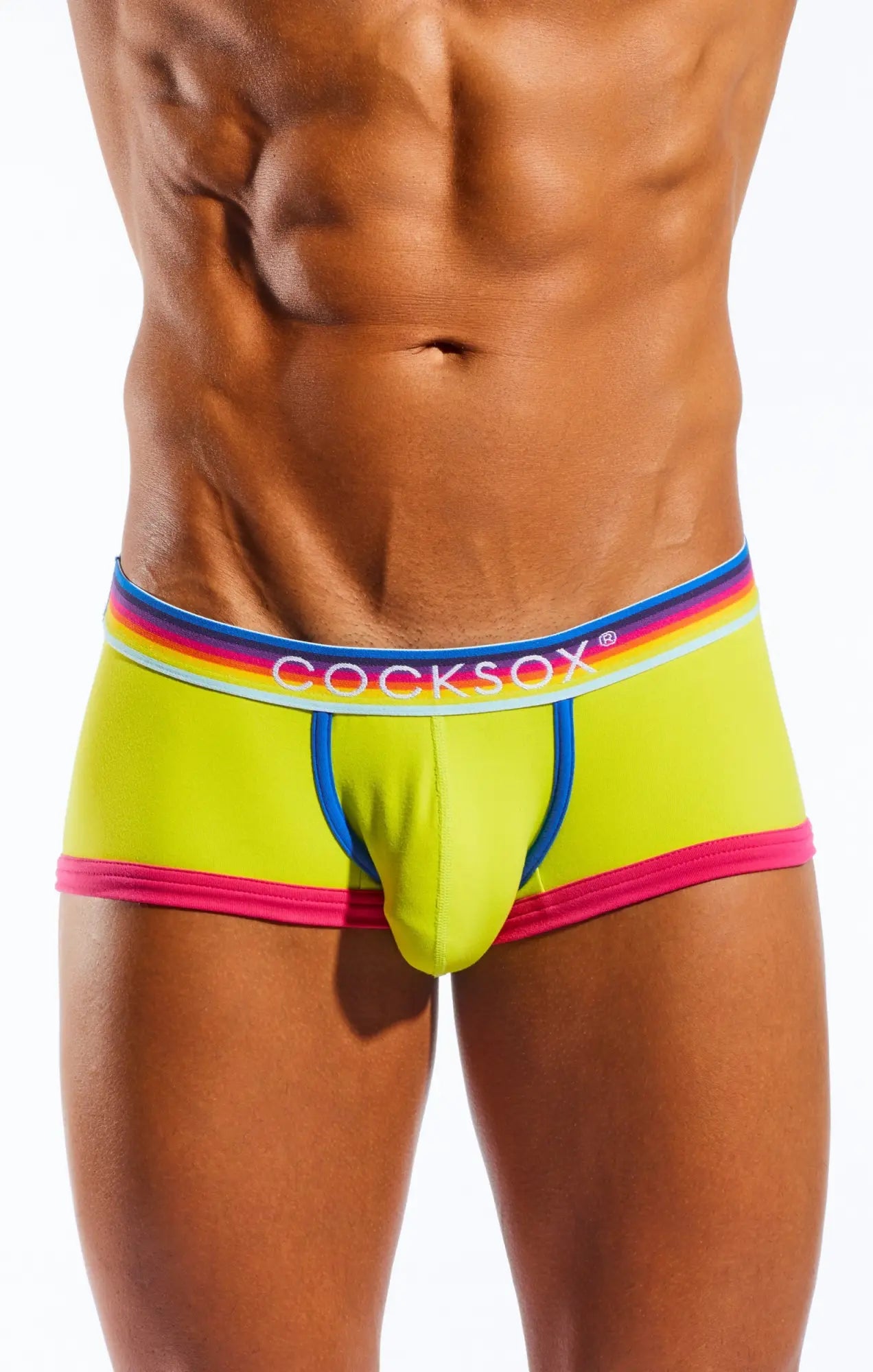 Vibrant neon yellow cocksox cx68n trunk briefs with rainbow-striped elastic waistband and pink blue white trim