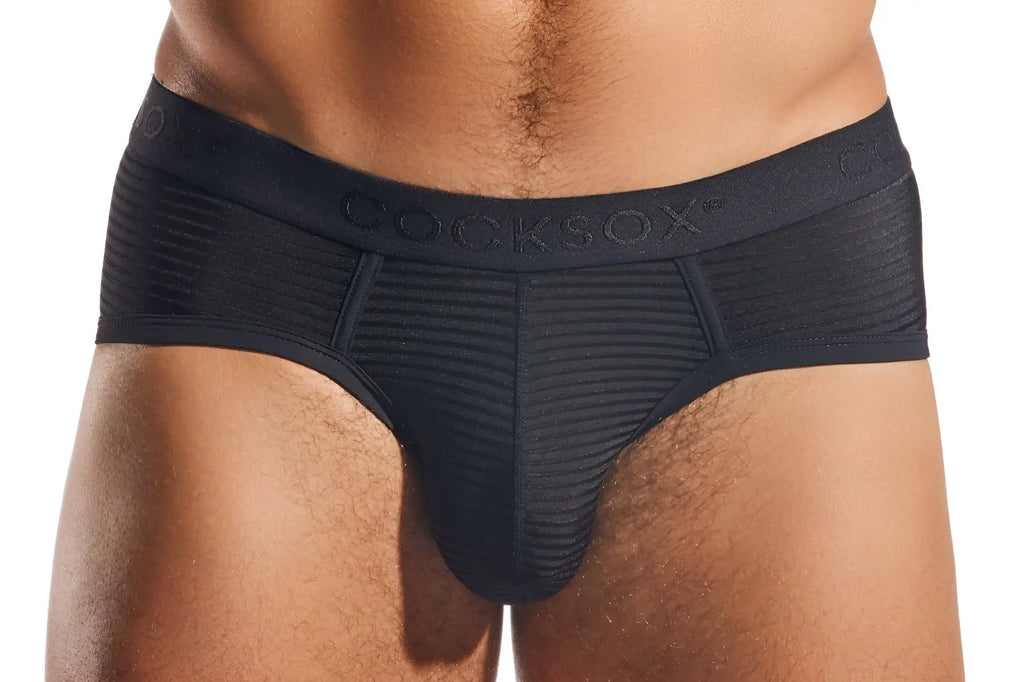 Black cocksox cx76lux semi-sheer sports briefs with textured ribbed fabric and elastic waistband shown from back side