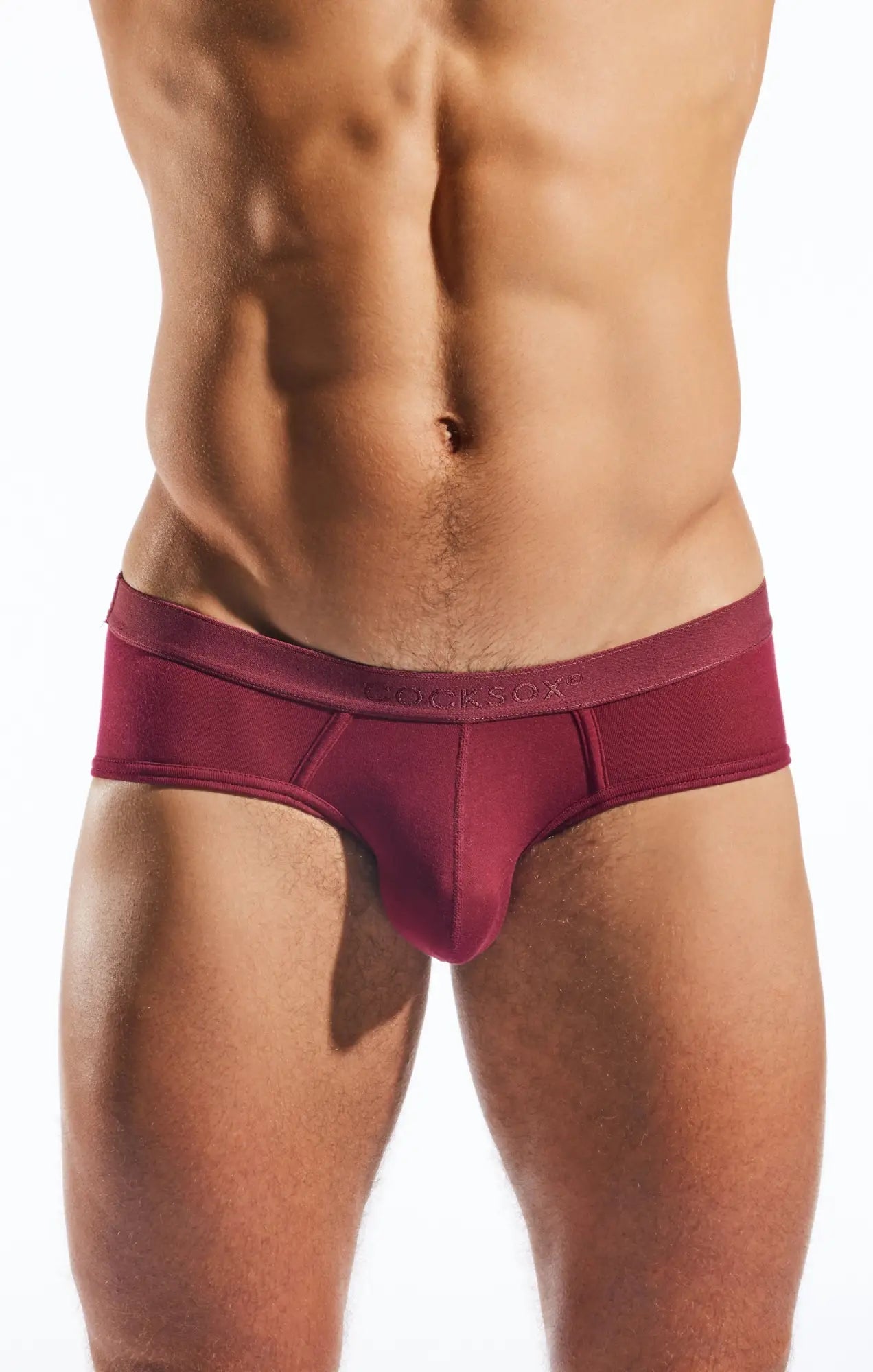 A maroon form-fitting mens brief with smooth elastic waistband and subtle stitching from Cocksox CX76MD Sports Brief
