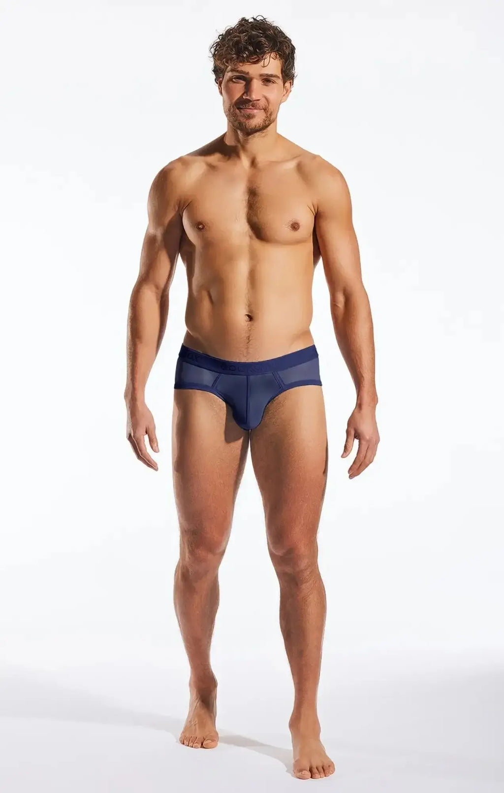 Navy blue mesh sports briefs with solid fabric waistband by Cocksox cx76me shown from the back side